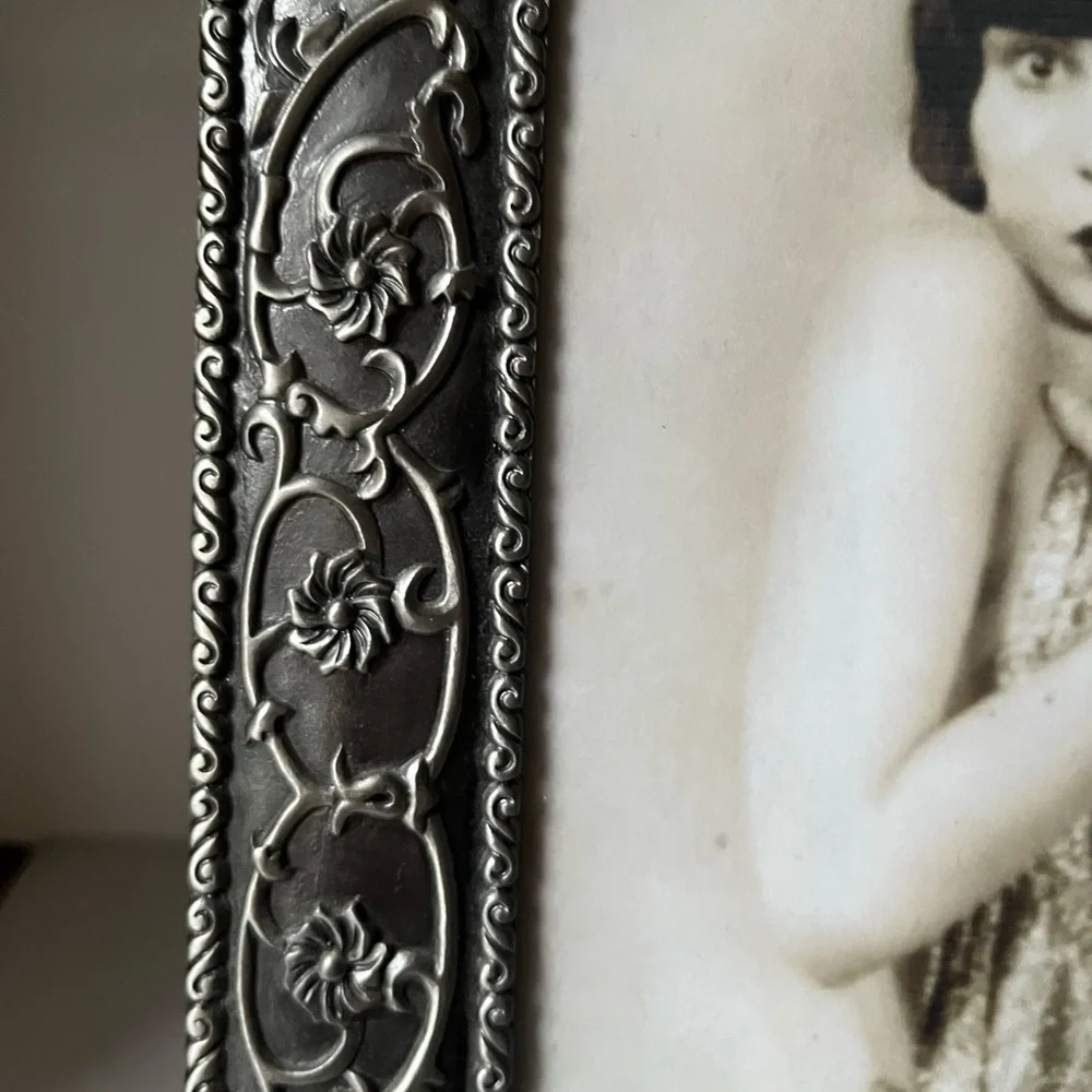 Large ornate silver Frame for photo 8”x10” free standing..
